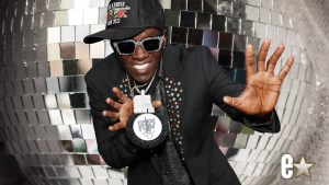 Flavor Flav infront of a mirrorball