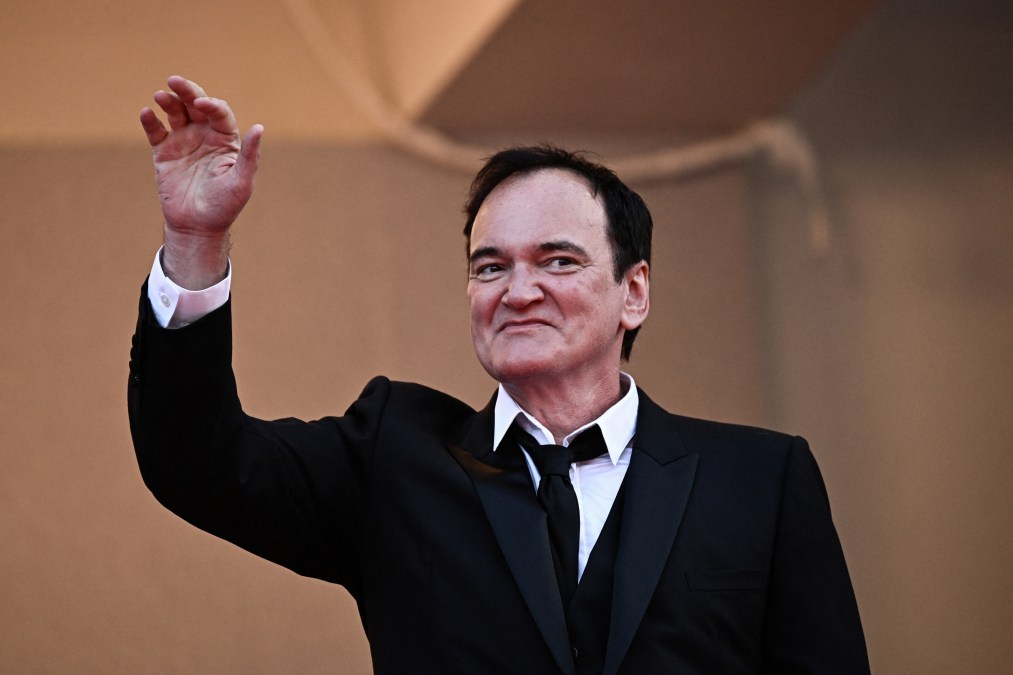 US director Quentin Tarantino waves 