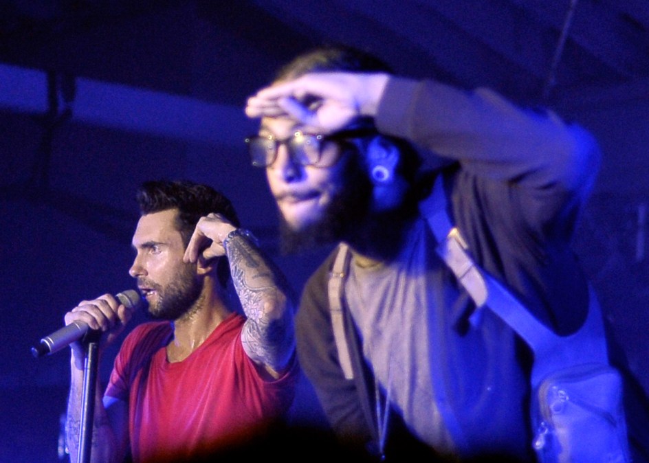  Singers Adam Levine of Maroon 5 and  Travie McCoy 