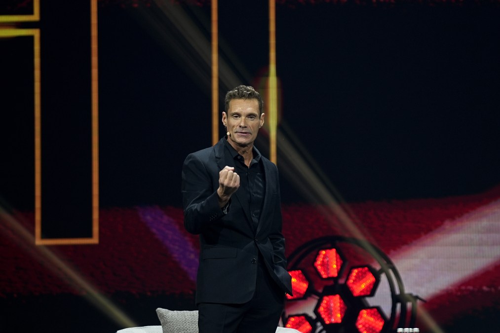 Ryan Seacrest speaks on stage