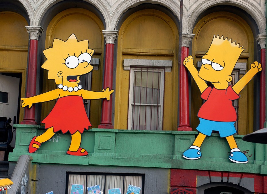 Lisa Simpson and Bart Simpson cut-outs on display