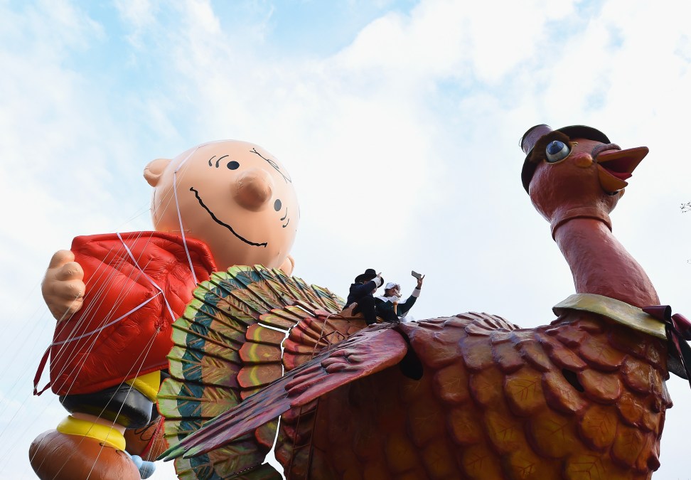 The Charlie Brown Balloon floats at Macy's Thanksgiving Day Parade