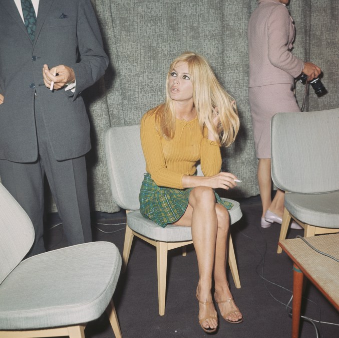 Brigitte Bardot sitting on a chair