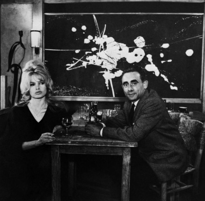 Brigitte Bardot and Henri-Georges Clouzot are photographed in 1960 in a restaurant