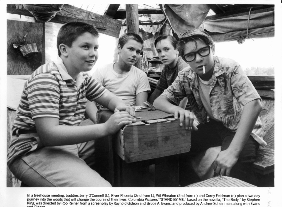 Jerry O'Connell, River Phoenix, Wil Wheaton, and Corey Feldman are gathered around together in a scene from the film 'Stand By Me', 1986. 