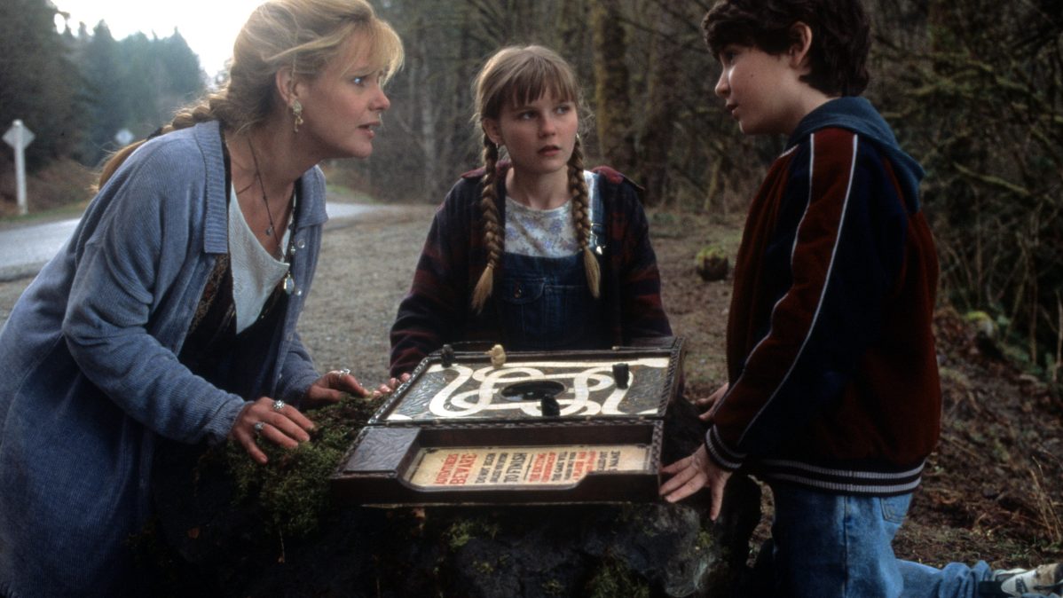 Bonnie Hunt, Kirsten Dunst, and Bradley Pierce in Jumanji (1995).