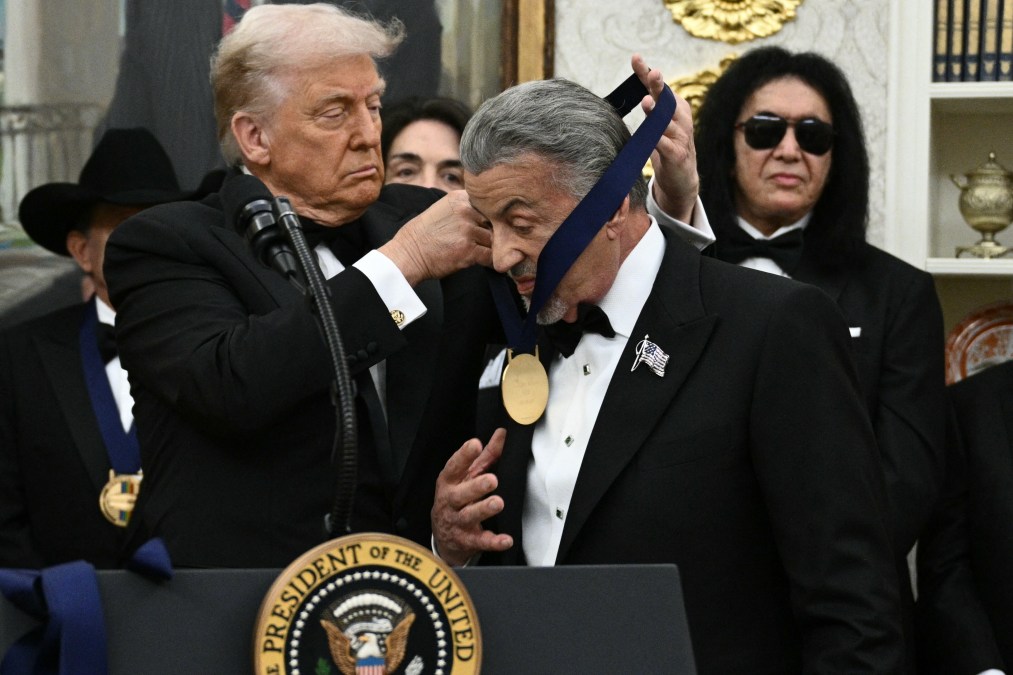 Kennedy Centre Honours recipient actor Sylvester Stallone receives a medal from US President Donald Trump