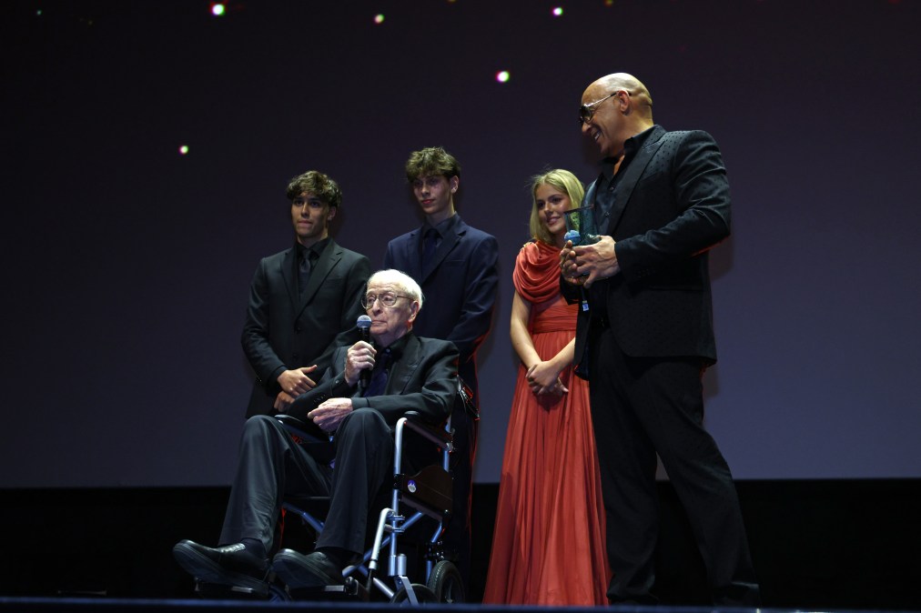 Vin Diesel (R) presents a Honoree Award to Michael Caine (C) 