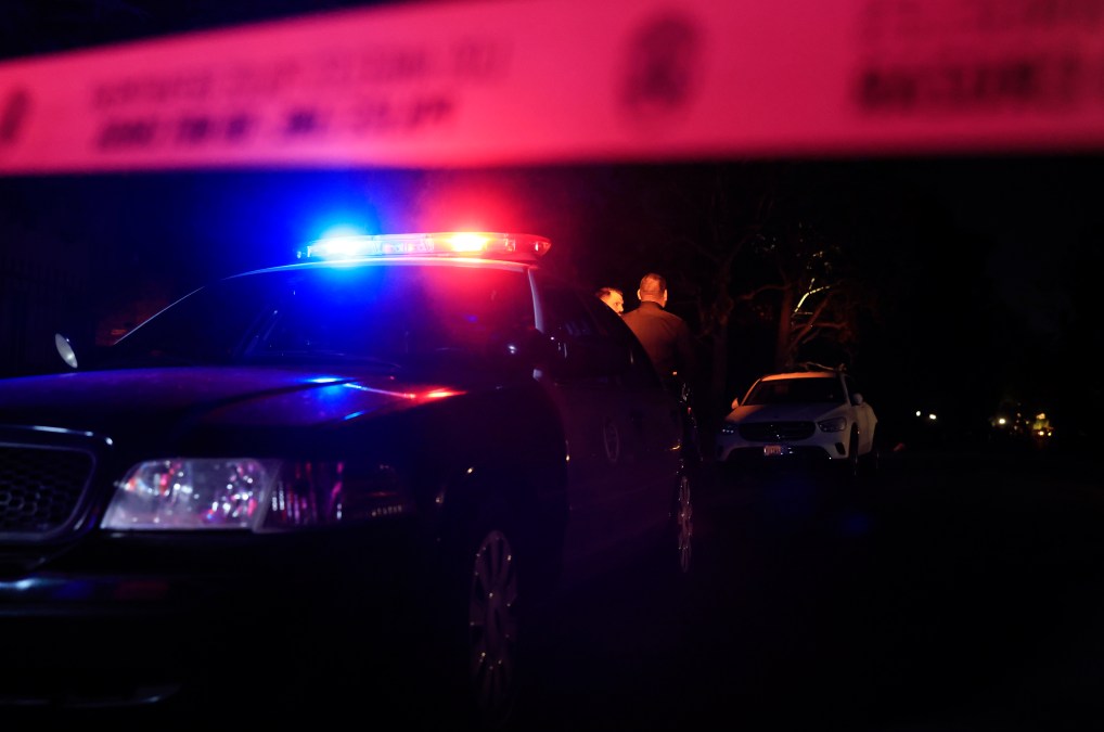 LAPD officers keep watch as the police investigate two people found dead in Rob Reiner's home