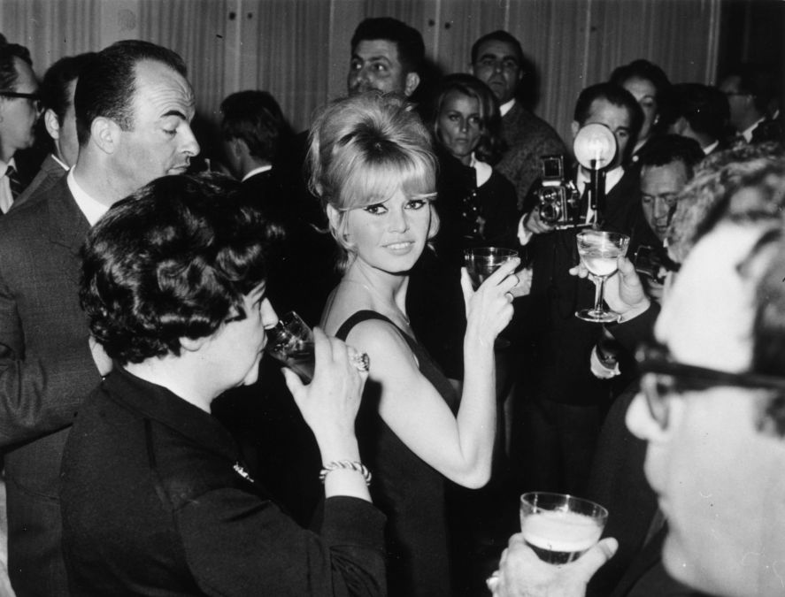 22nd April 1963: French film star Brigitte Bardot raises her glass