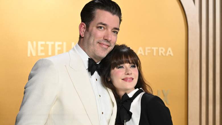 Jonathan Scott and Zooey Deschanel smiling at event