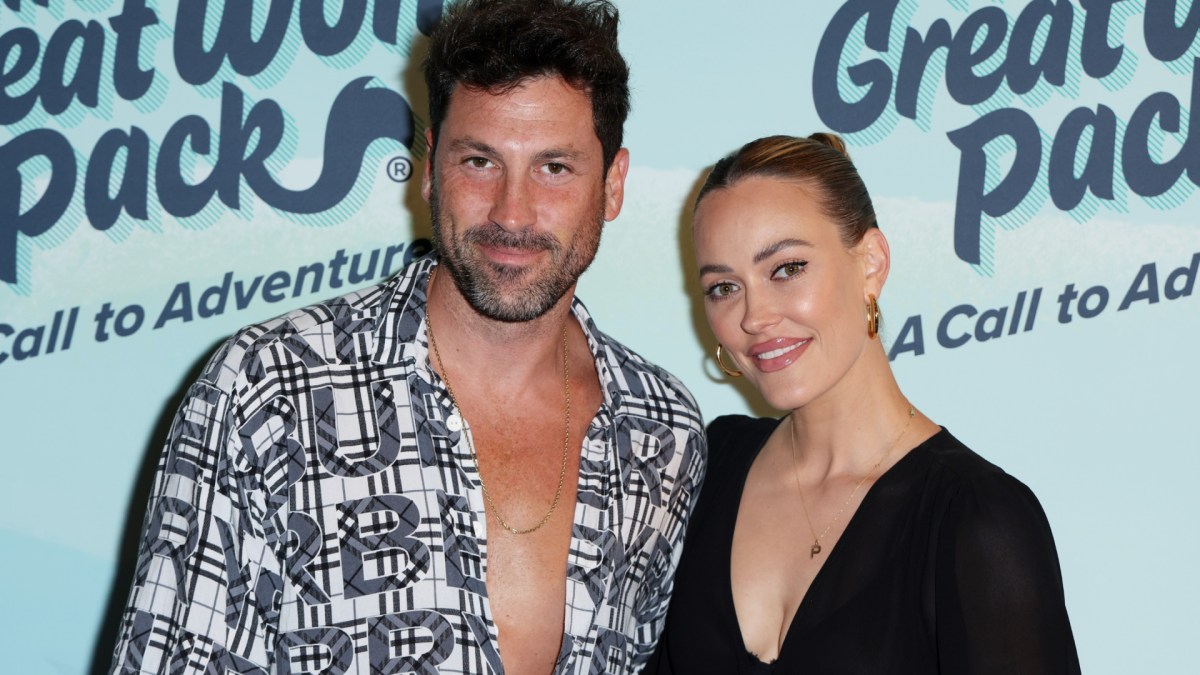 Peta Murgatroyd, smiling, and Maksim Chmerkovskiy