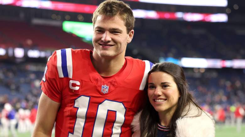 Drake Maye #10 of the New England Patriots and his wife Ann Michael Maye pose for a photo prior to the game against the New York Giants at Gillette Stadium on December 01, 2025 in Foxborough, Massachusetts