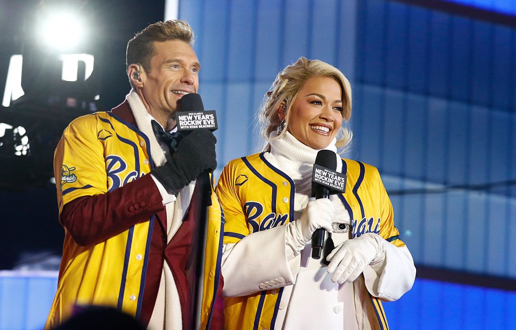 Ryan Seacrest and Rita Ora speak as revelers gather to celebrate New Year's Eve in Times Square