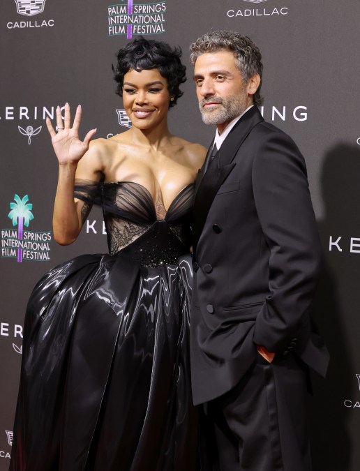 Teyana Taylor and Oscar Isaac pose for photos at the 37th Annual Palm Springs International Film Festival Film Awards