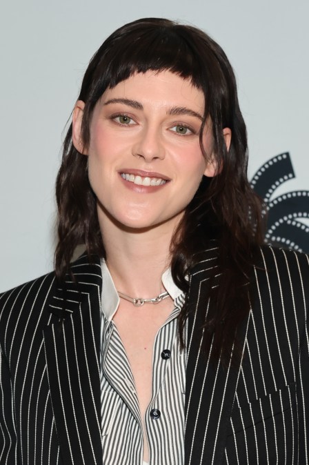 Kristen Stewart smiling for phtoos