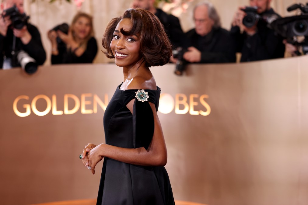 Ayo Edebiri poses for photos at the Golden Globes 2026