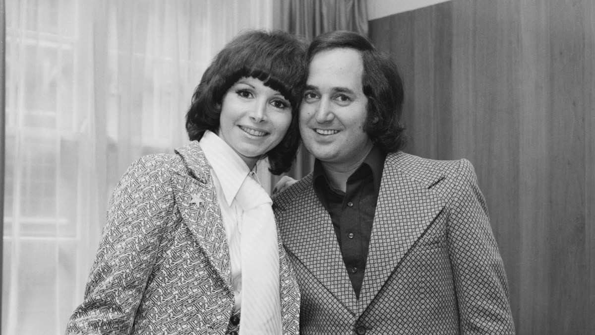 Neil Sedaka with his wife Leba pose for a photo