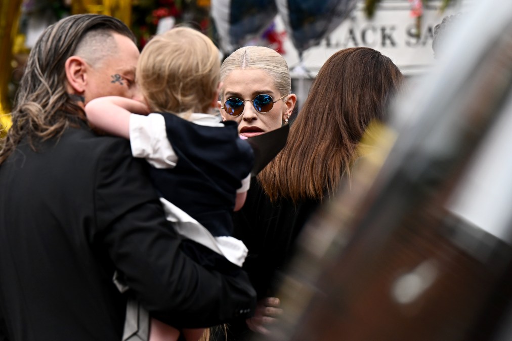 Sid Wilson (L), Kelly Osbourne (C) and their son Sidney Wilson