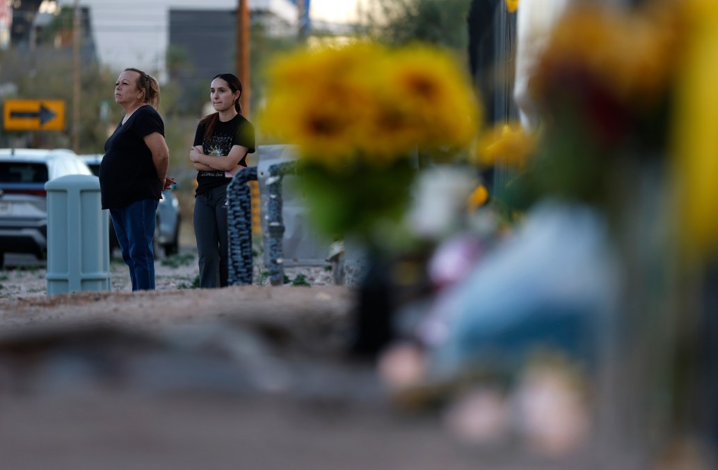 Frances Breay looks on as she visits a makeshift memorial for Nancy Guthrie