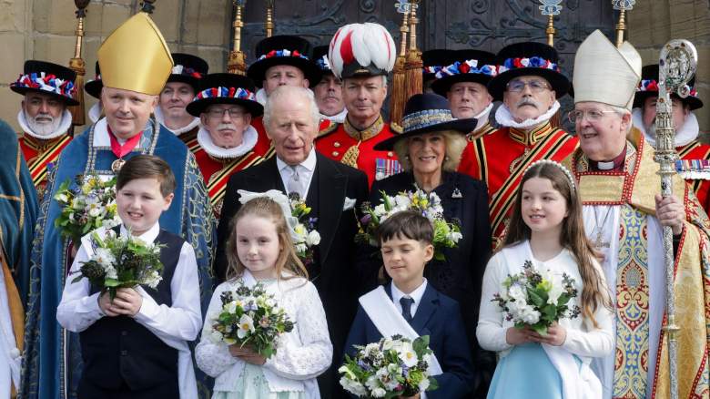 Members of the the Yeomen of the Guard, King Charles III, Queen Camilla and The Right Reverend Gregory Cameron, Bishop of St Asaph pose for a formal photograph after the Royal Maundy Service at St Asaph Cathedral on April 02, 2026 in St Asaph, Wales. The King presented the Maundy recipients, 77 men and 77 women with two purses: one red and one white, containing Maundy money. The white purse held specially minted silver Maundy coins