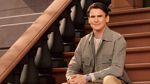 Nick Barber sits on brownstone steps in &ldquo;In the City&rdquo; Season 1 promo photo