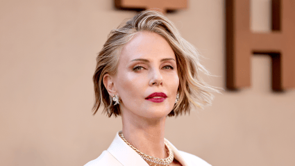 Charlize Theron Flaunts Fabulous Figure in Daring Backless Dress in Korea