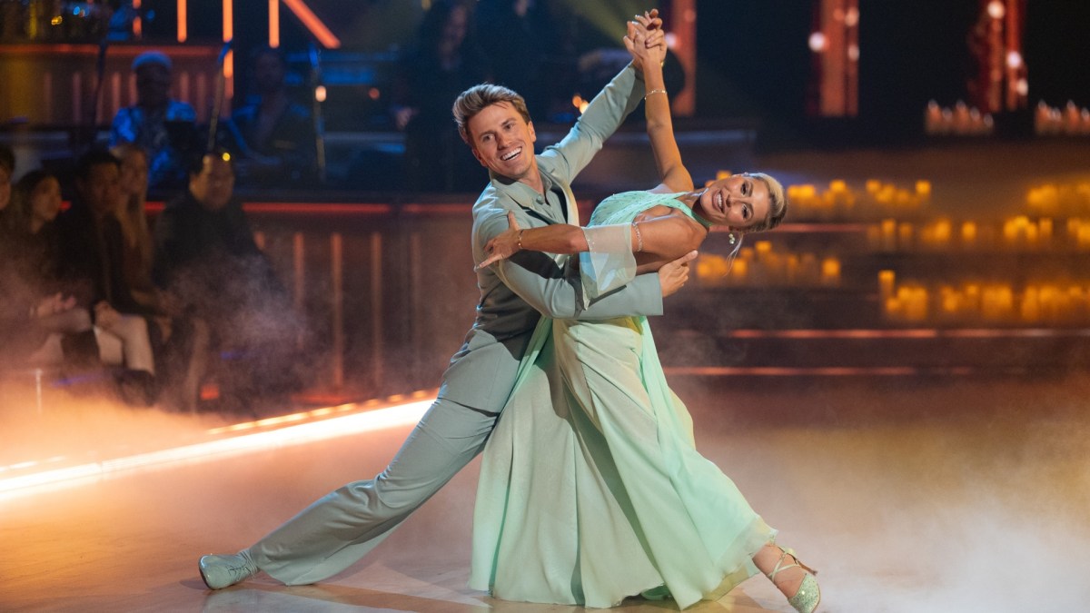 Jackson Olson and Emma Slater dance on light blue outfits.