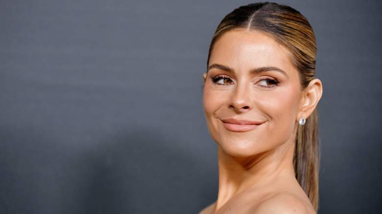 Maria Menounos smiles over her shoulder.