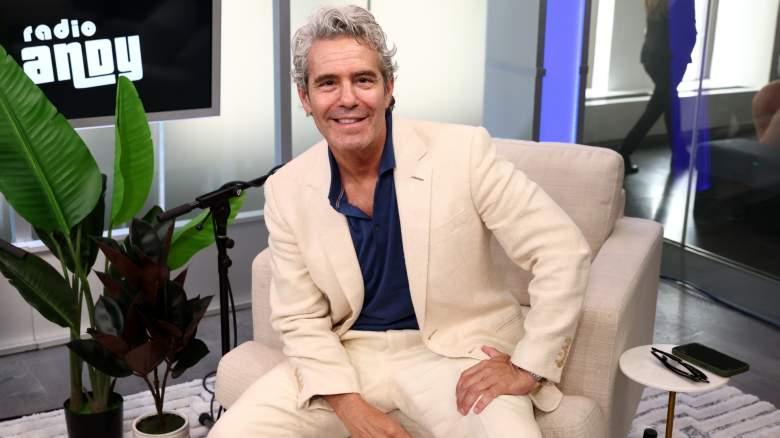 Andy Cohen wears a cream suit in the studio of 'Radio Andy'
