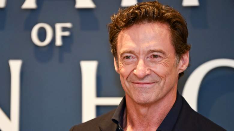 Hugh Jackman poses for photos at an event