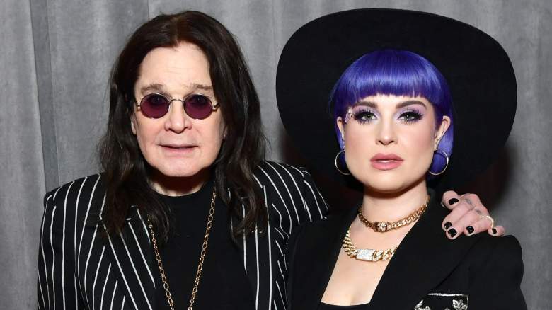 Ozzy Osbourne and Kelly Osbourne pose in black outfits.